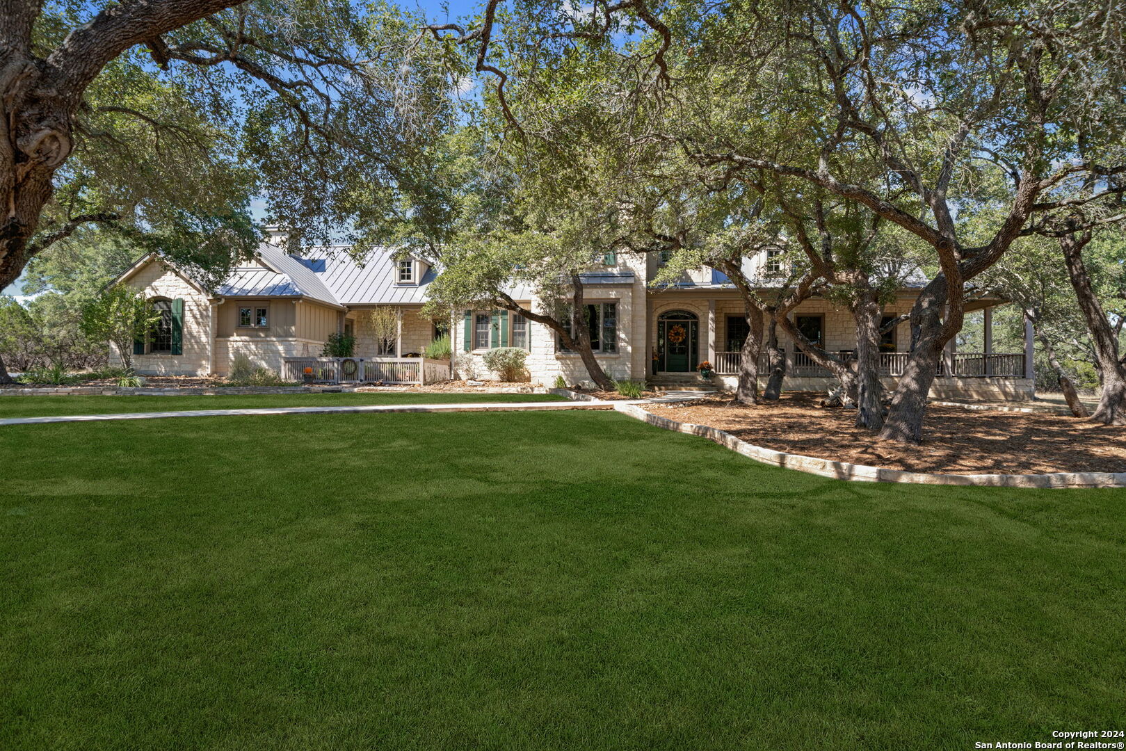 a front view of house with yard and outdoor seating