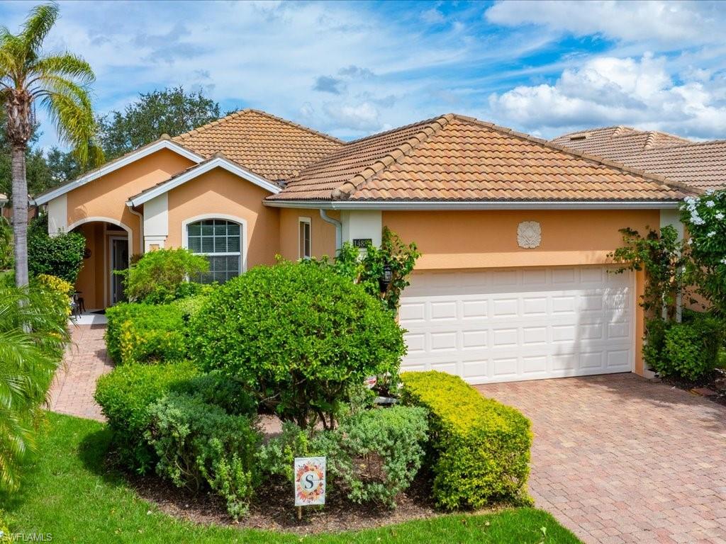 Mediterranean / spanish-style home featuring a two car garage