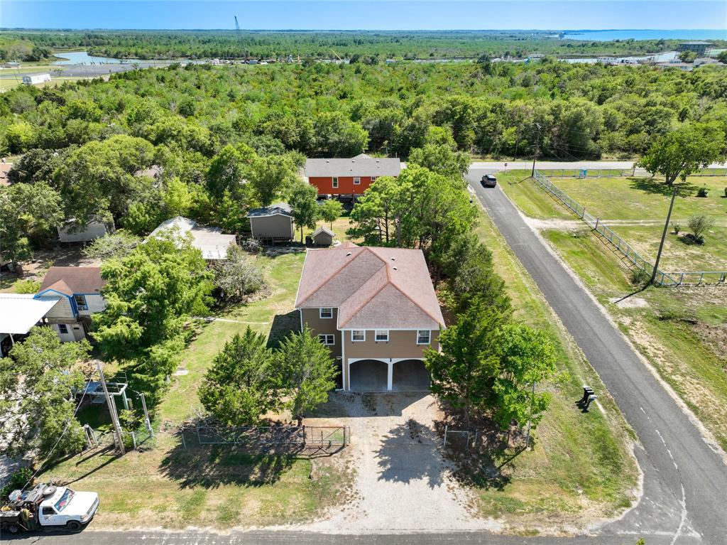 an aerial view of house with yard