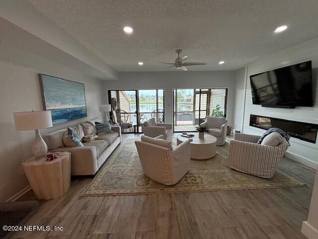 a living room with couches and a flat screen tv