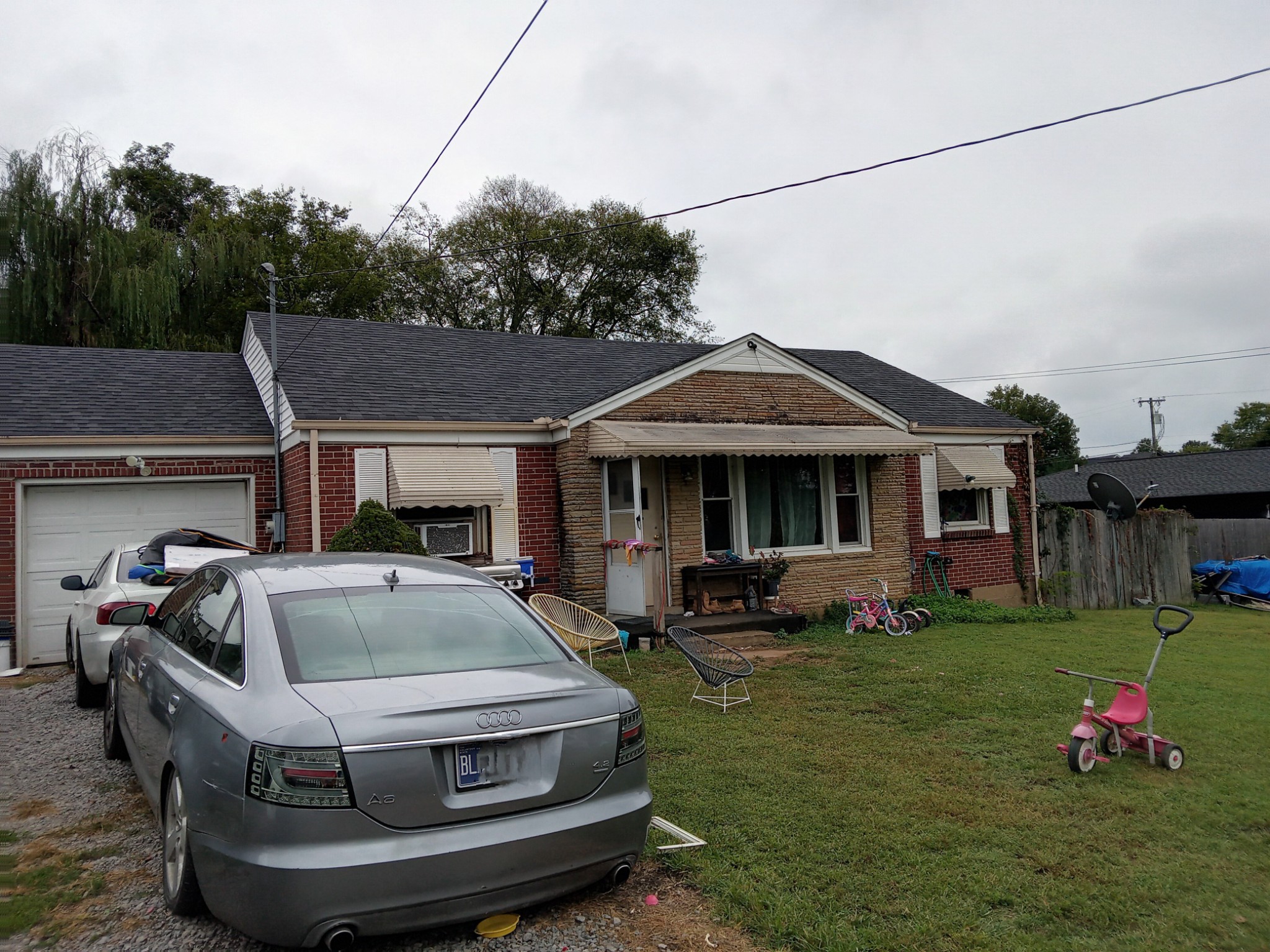 a front view of multiple houses with yard