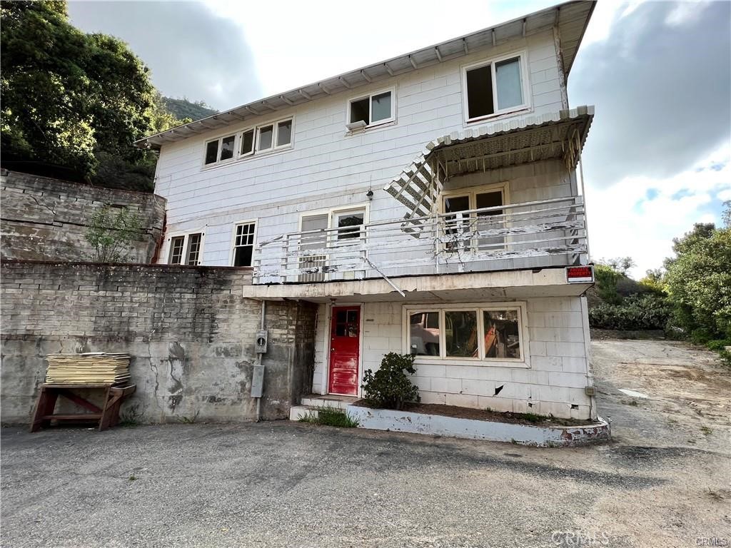 a front view of a house with parking space