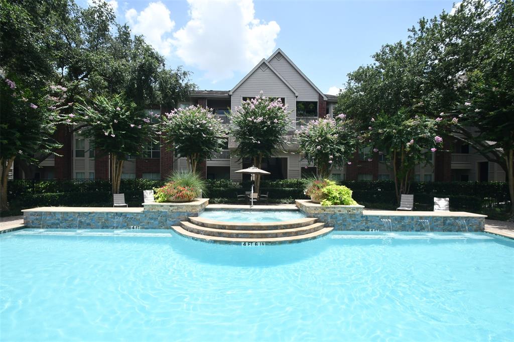 a front view of a house with a garden and patio