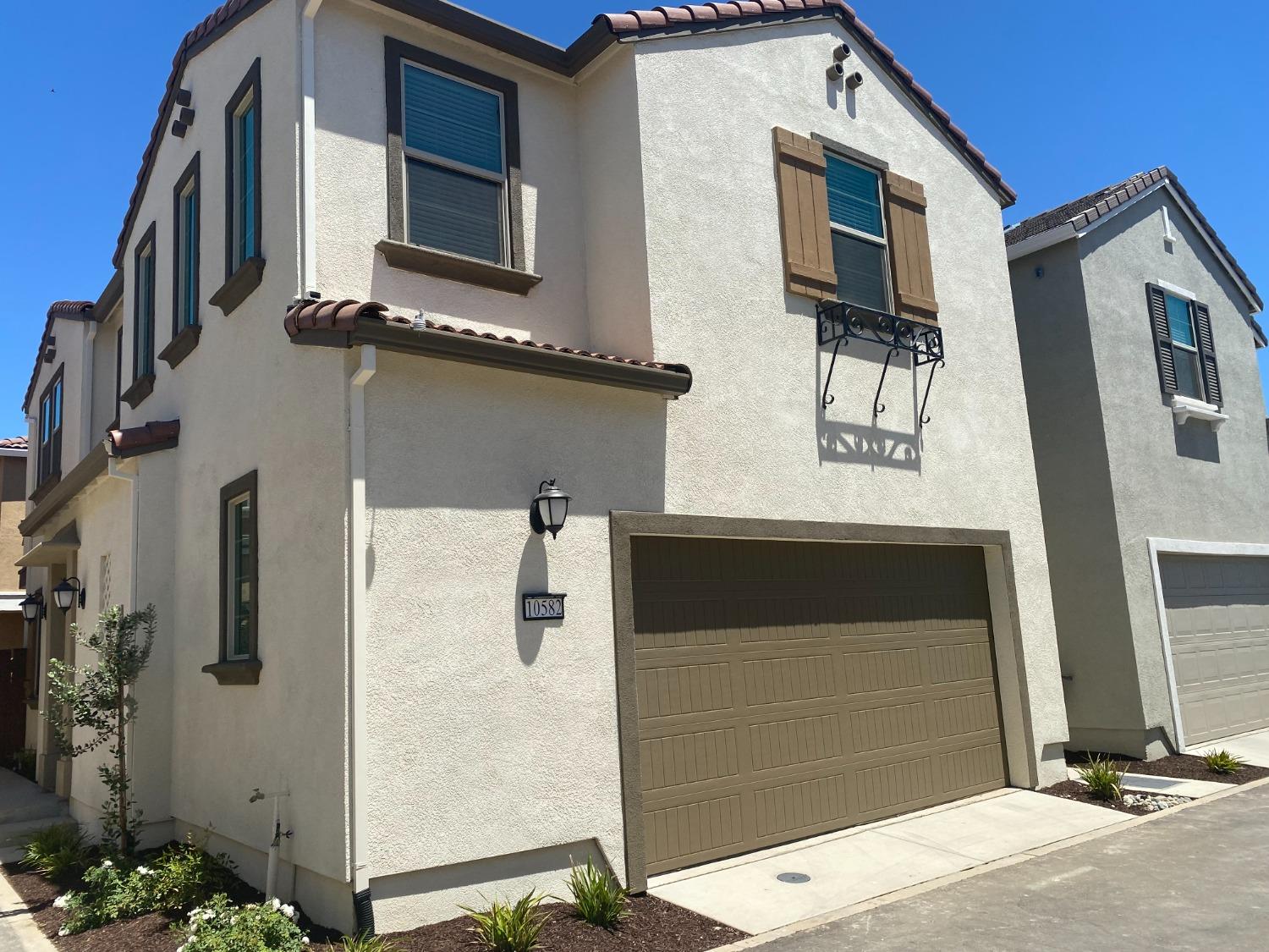 a front view of a house with garage