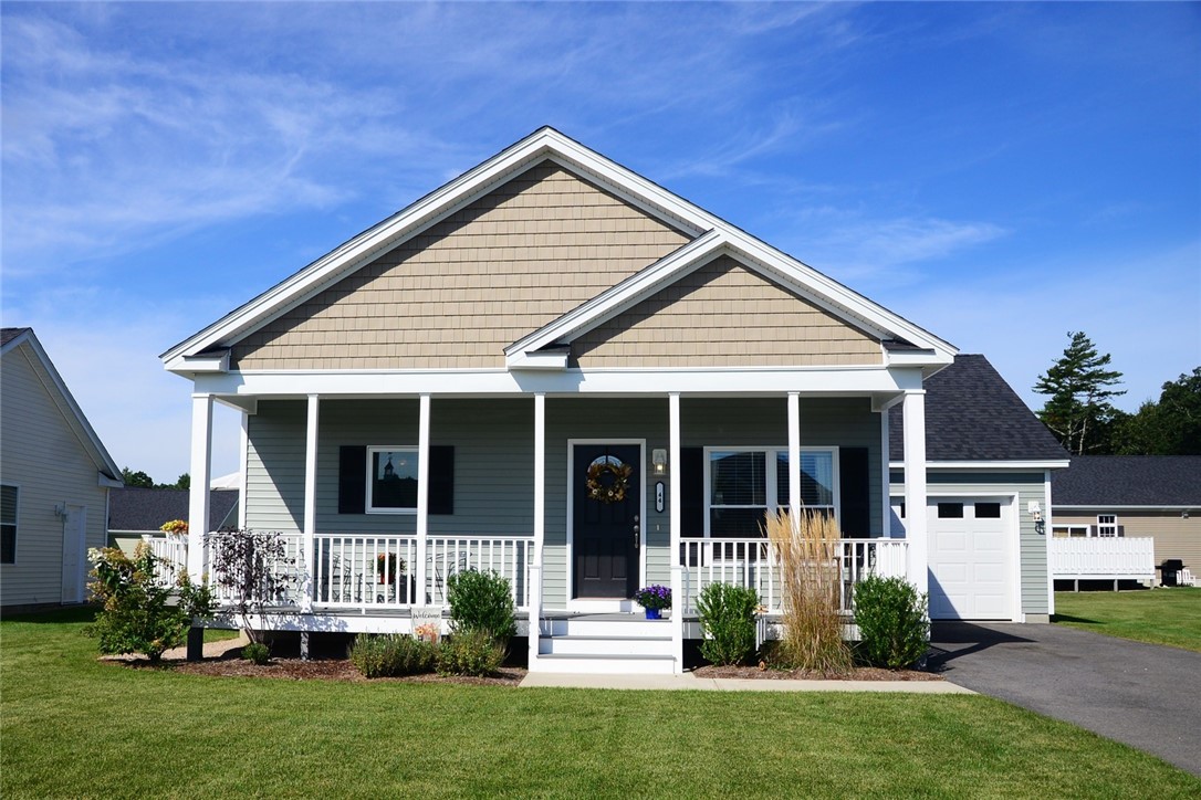 Front exterior with sunlit farmer's porch.