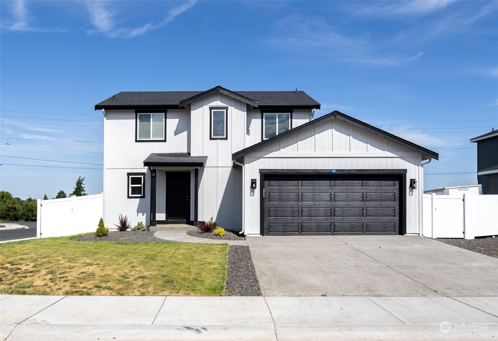 a front view of a house with garage