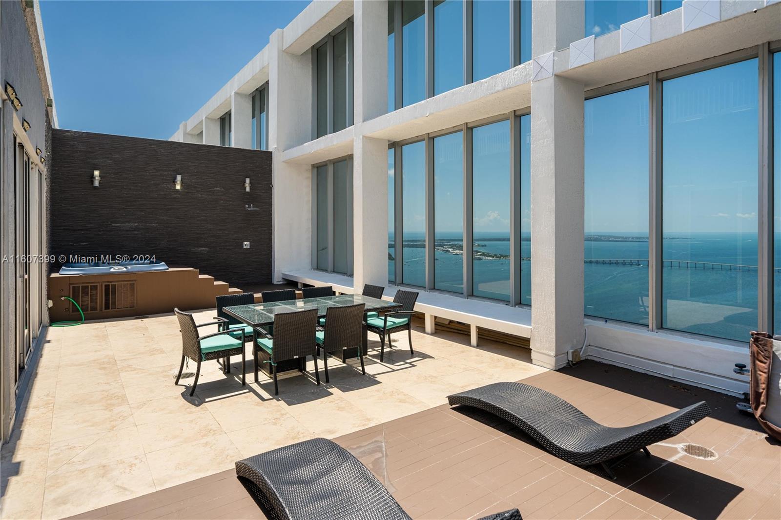 a view of a patio with table and chairs