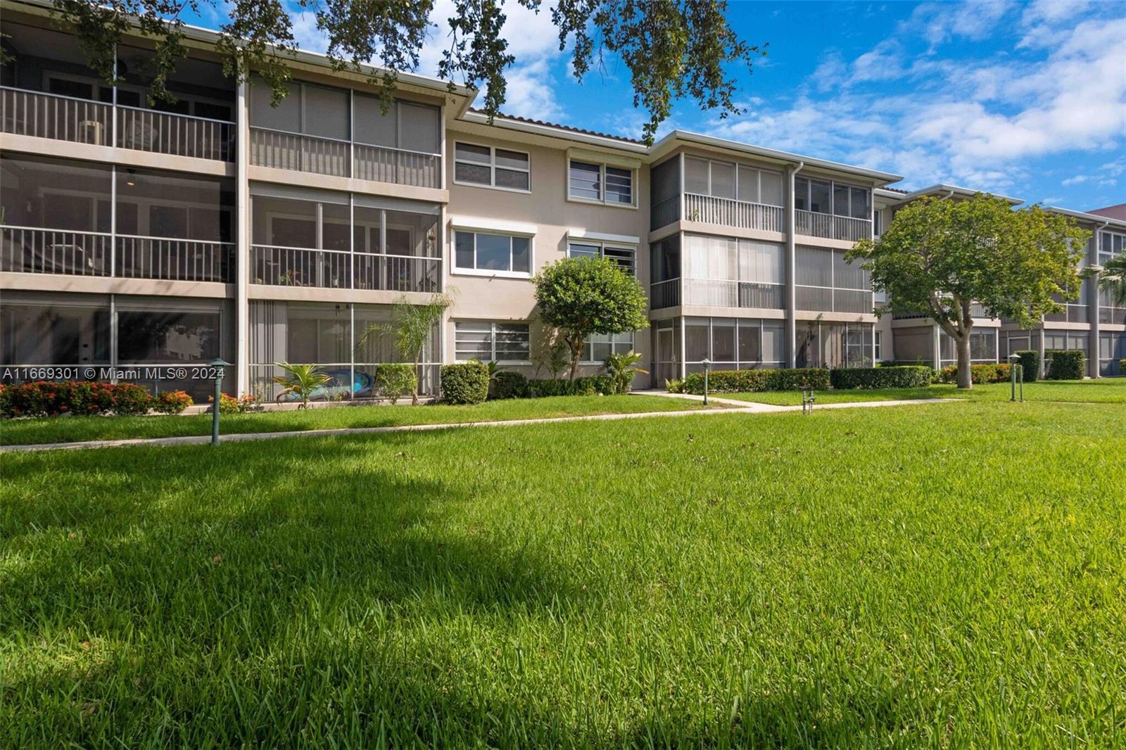 a front view of a building with a yard