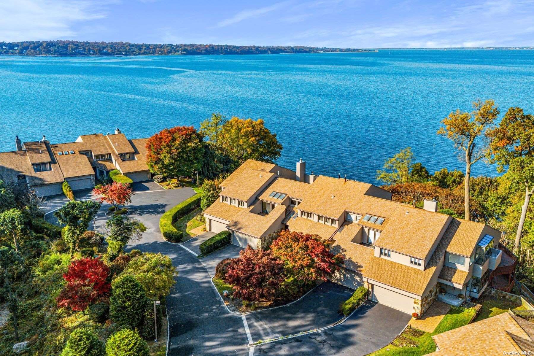 an aerial view of a house with a ocean view