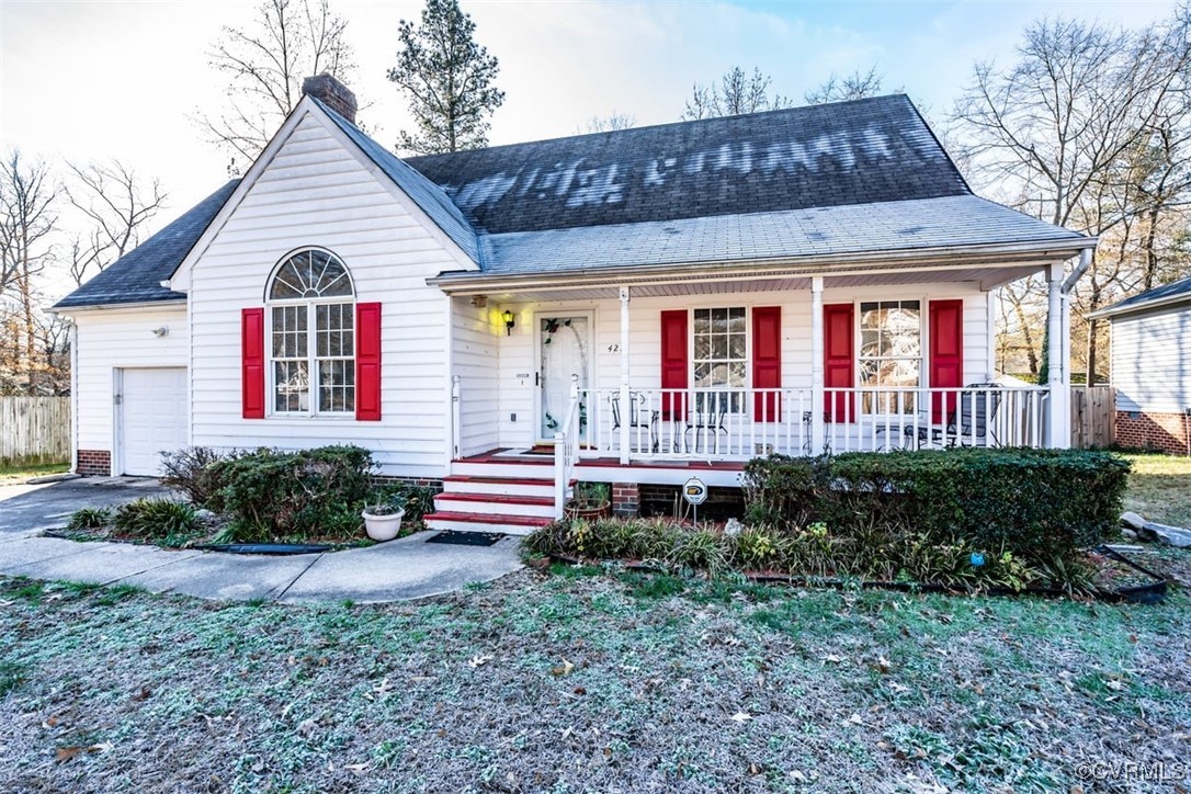 View of front of property with covered porch and a