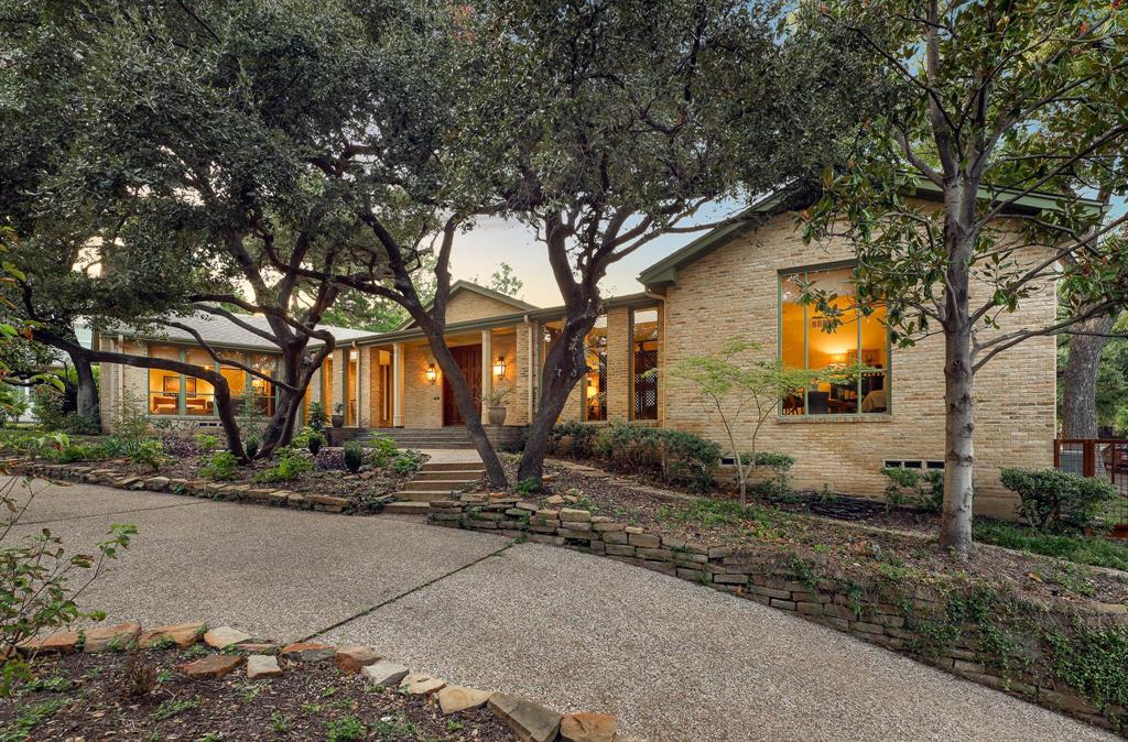 a backyard of a house with yard and outdoor seating