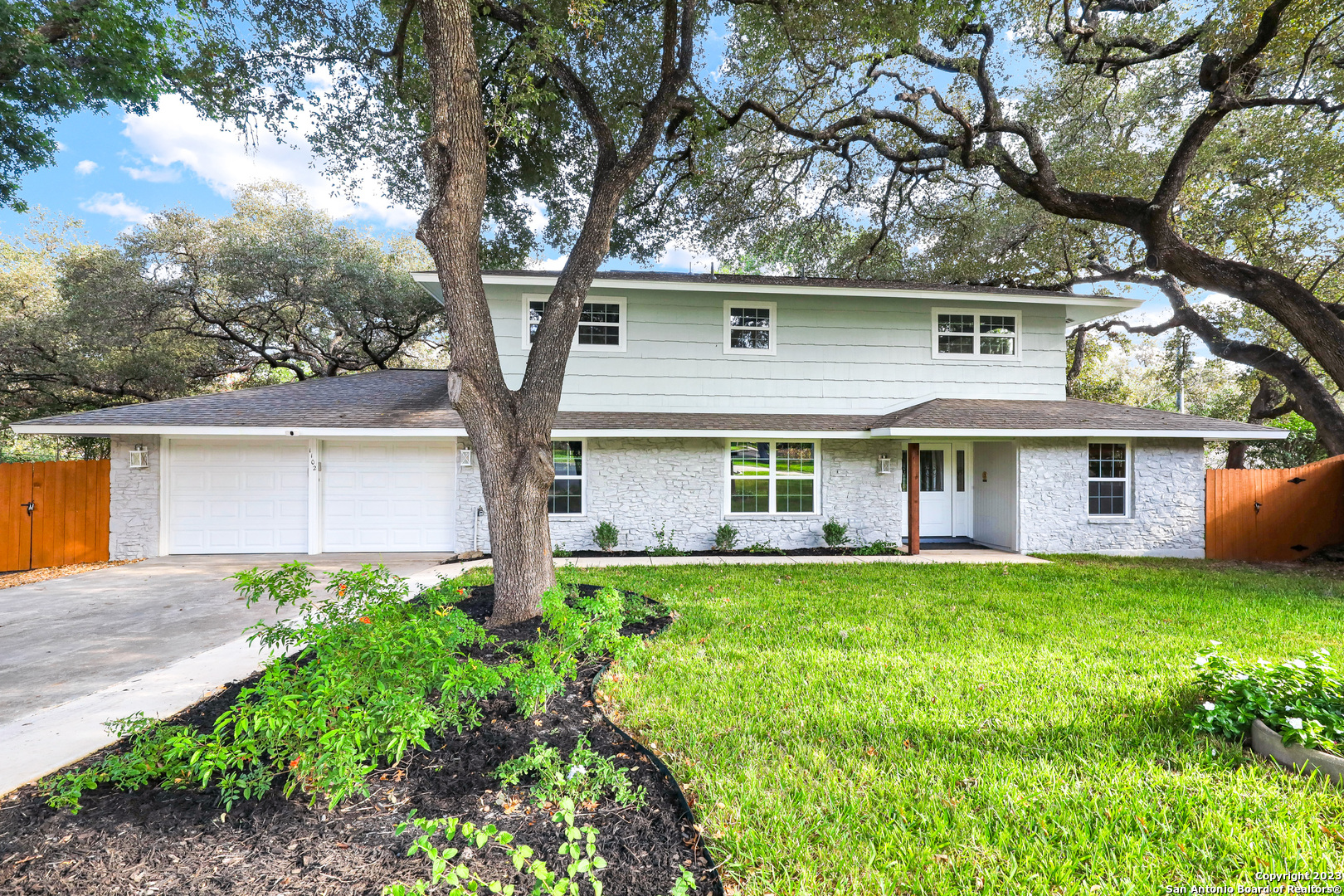 front view of a house with a yard