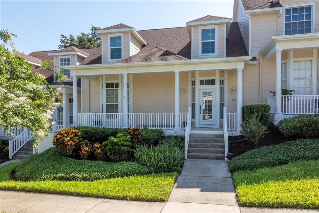 a front view of a house with a garden