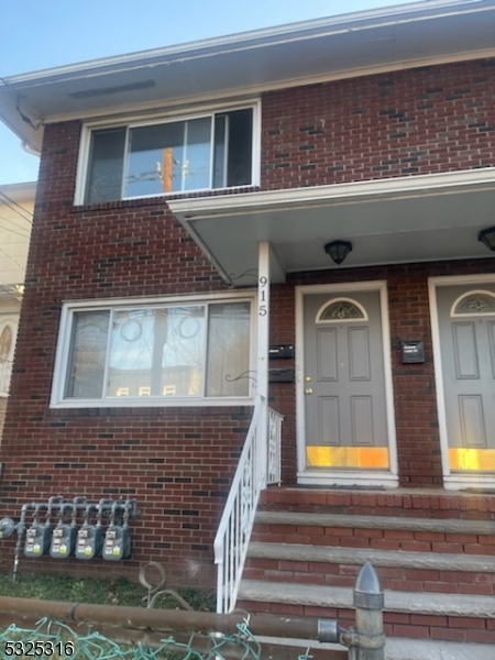 a view of front door of house with yard