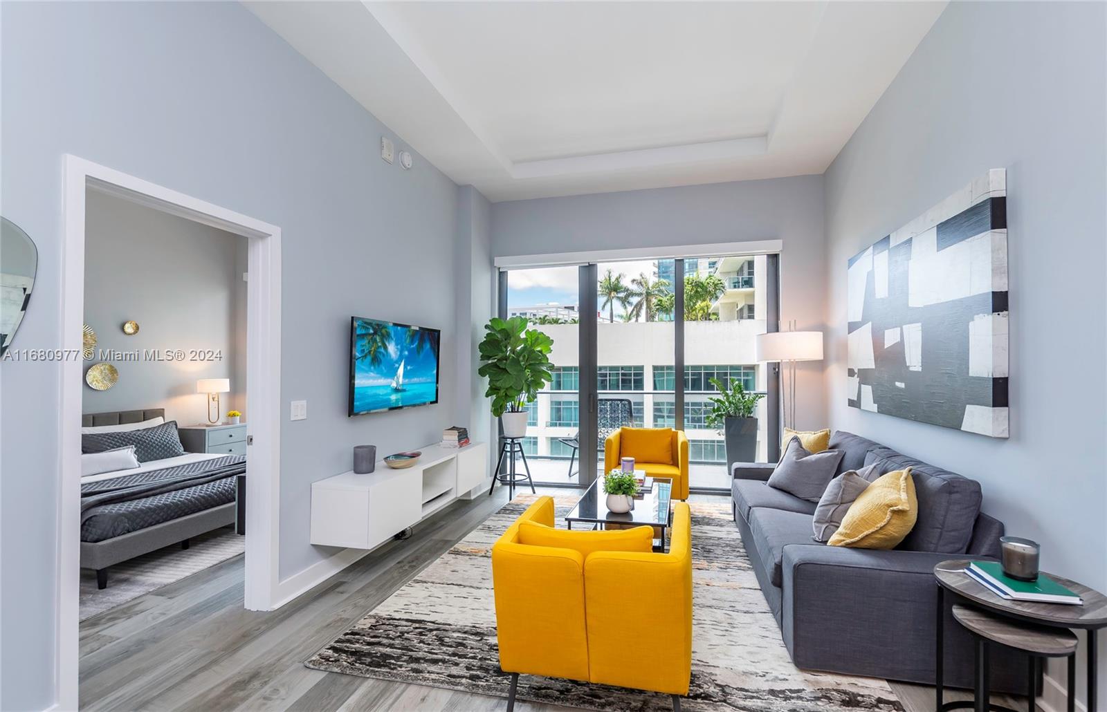 a living room with furniture and a flat screen tv