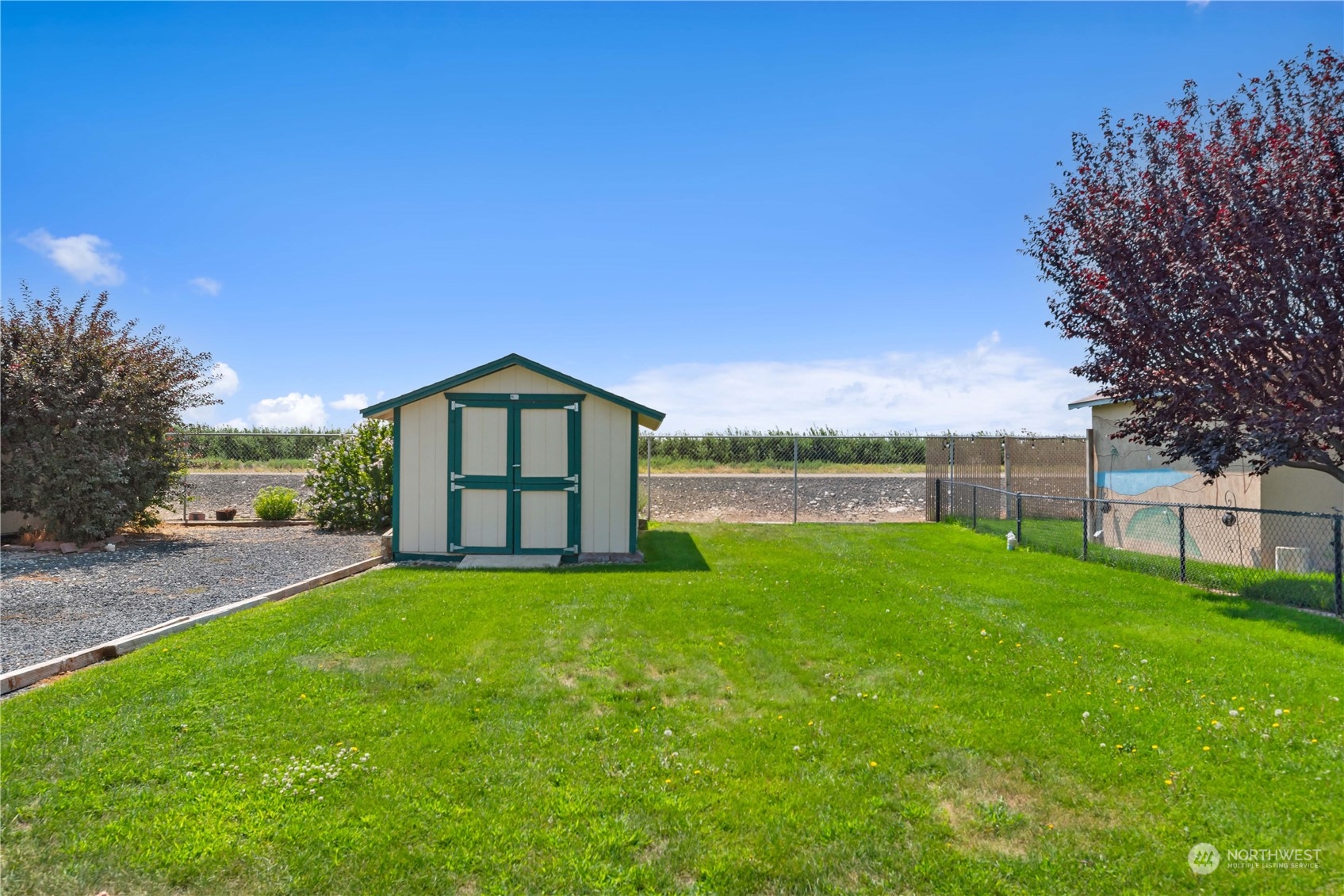 a view of a house with a yard and a garden