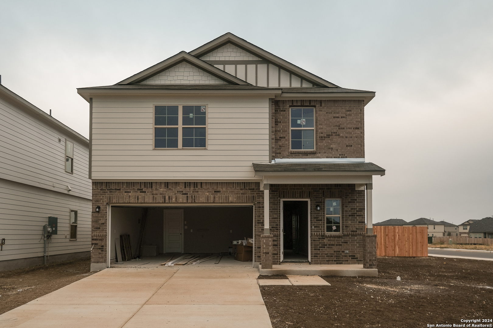 a front view of a house with yard