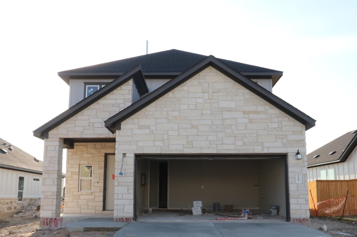 a front view of a house with glass windows