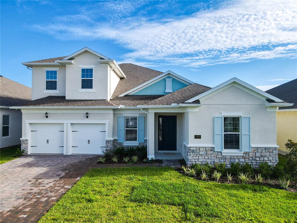 a view of a house with a yard