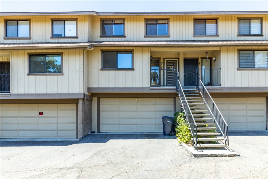 a front view of a house with stairs