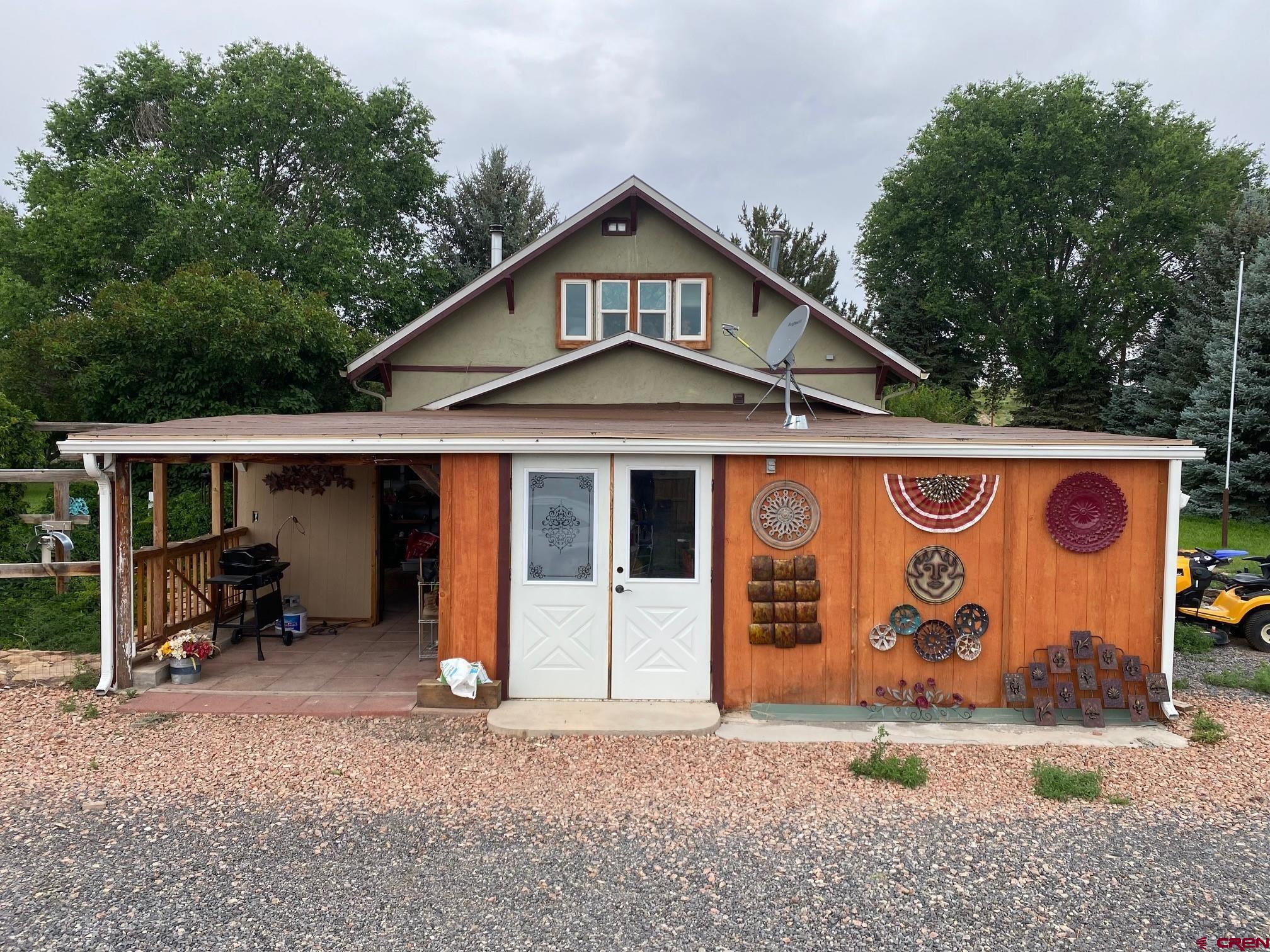 a front view of a house with parking area