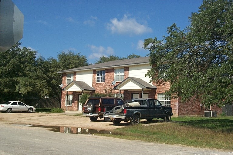 a view of street with parked cars