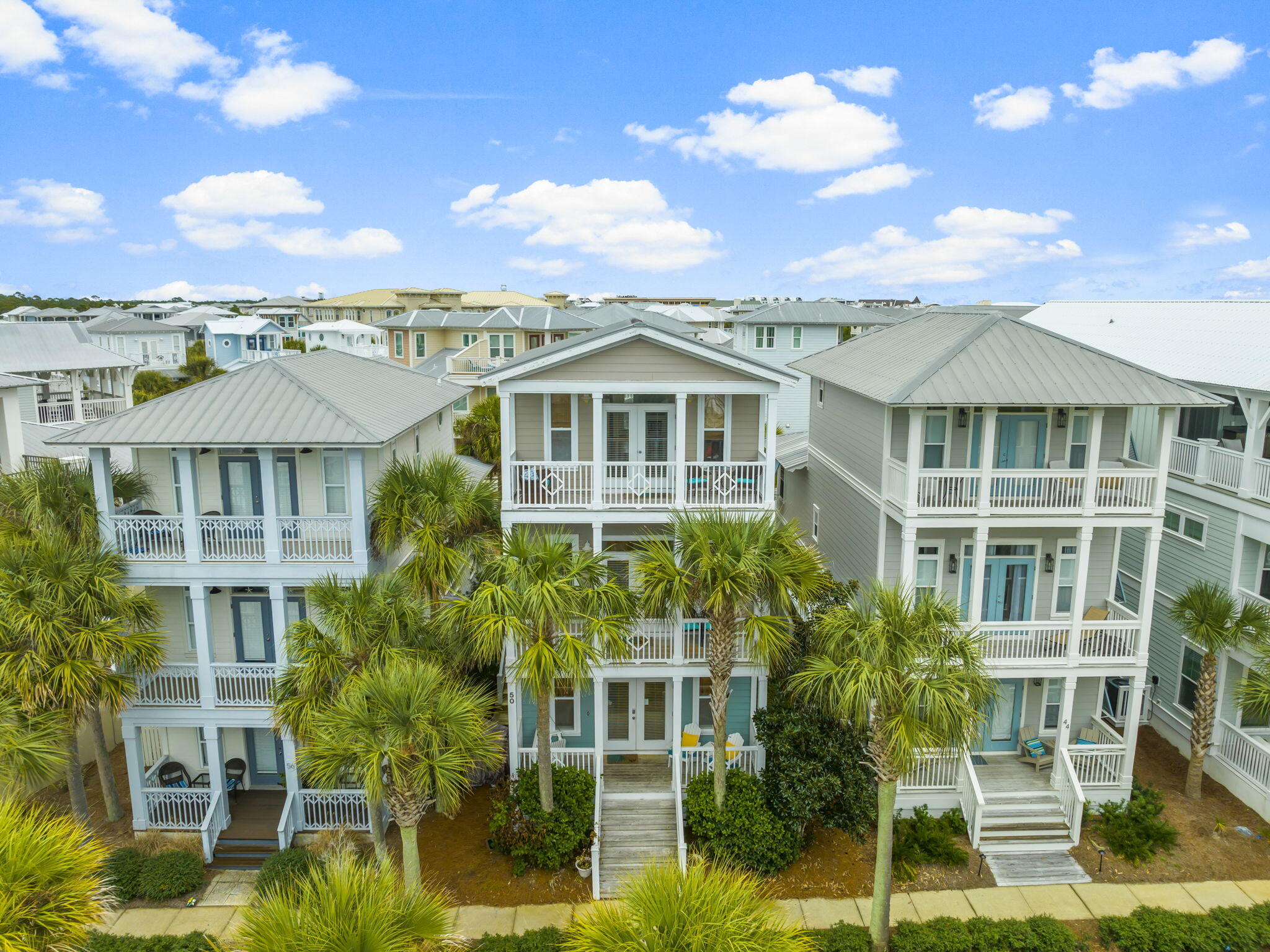 a front view of a residential apartment building with a yard