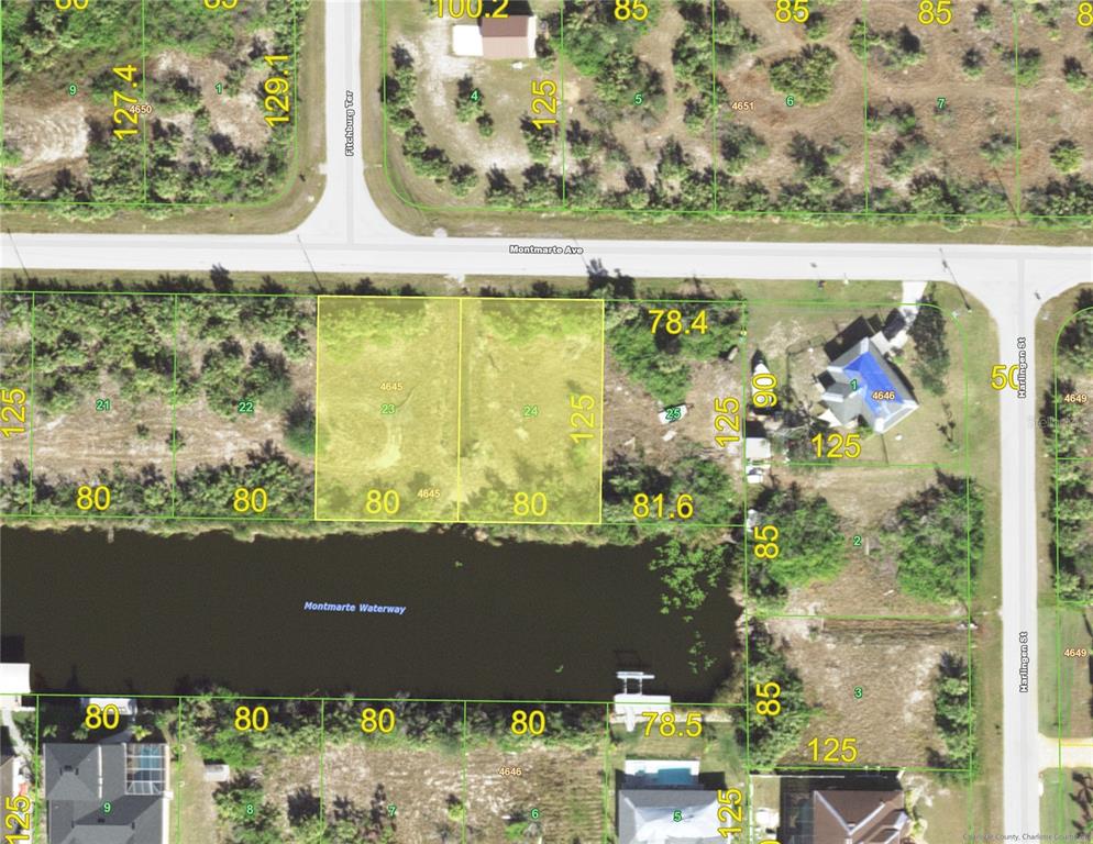 an aerial view of a residential building with an outdoor space