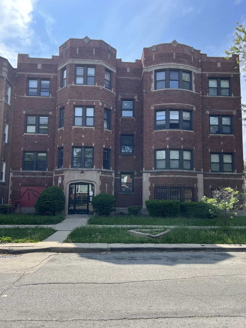 a front view of a building with garden