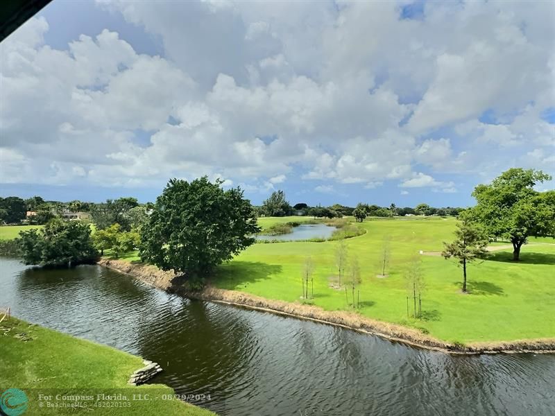 a view of a lake with a big yard