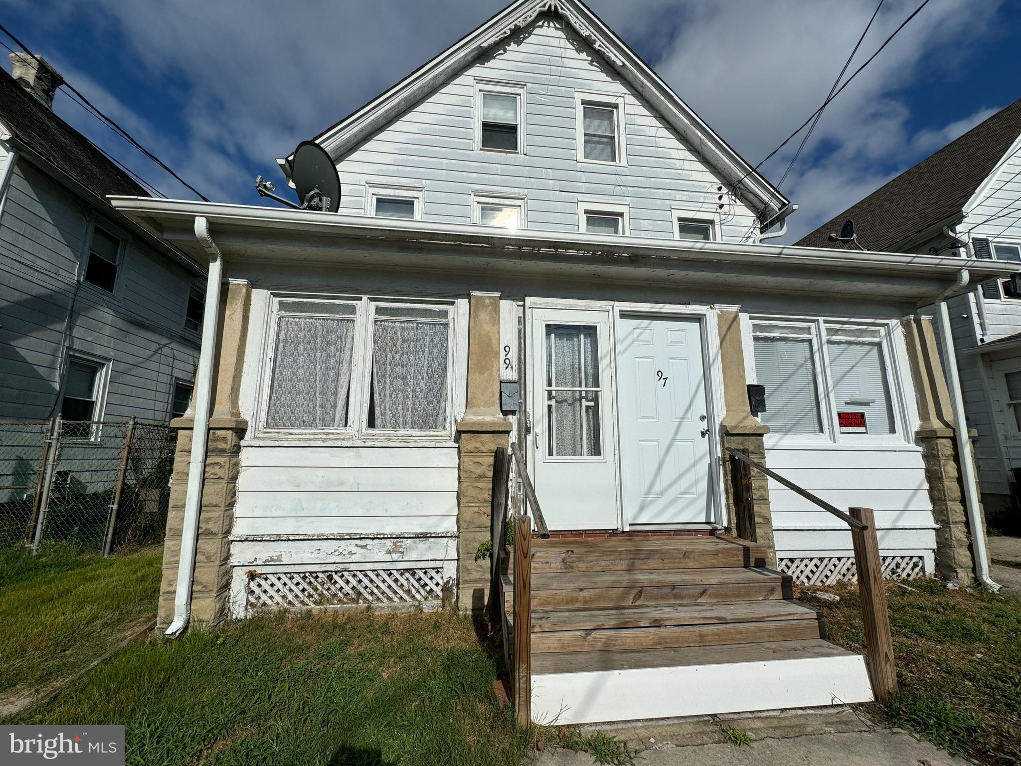 a front view of a house with a porch