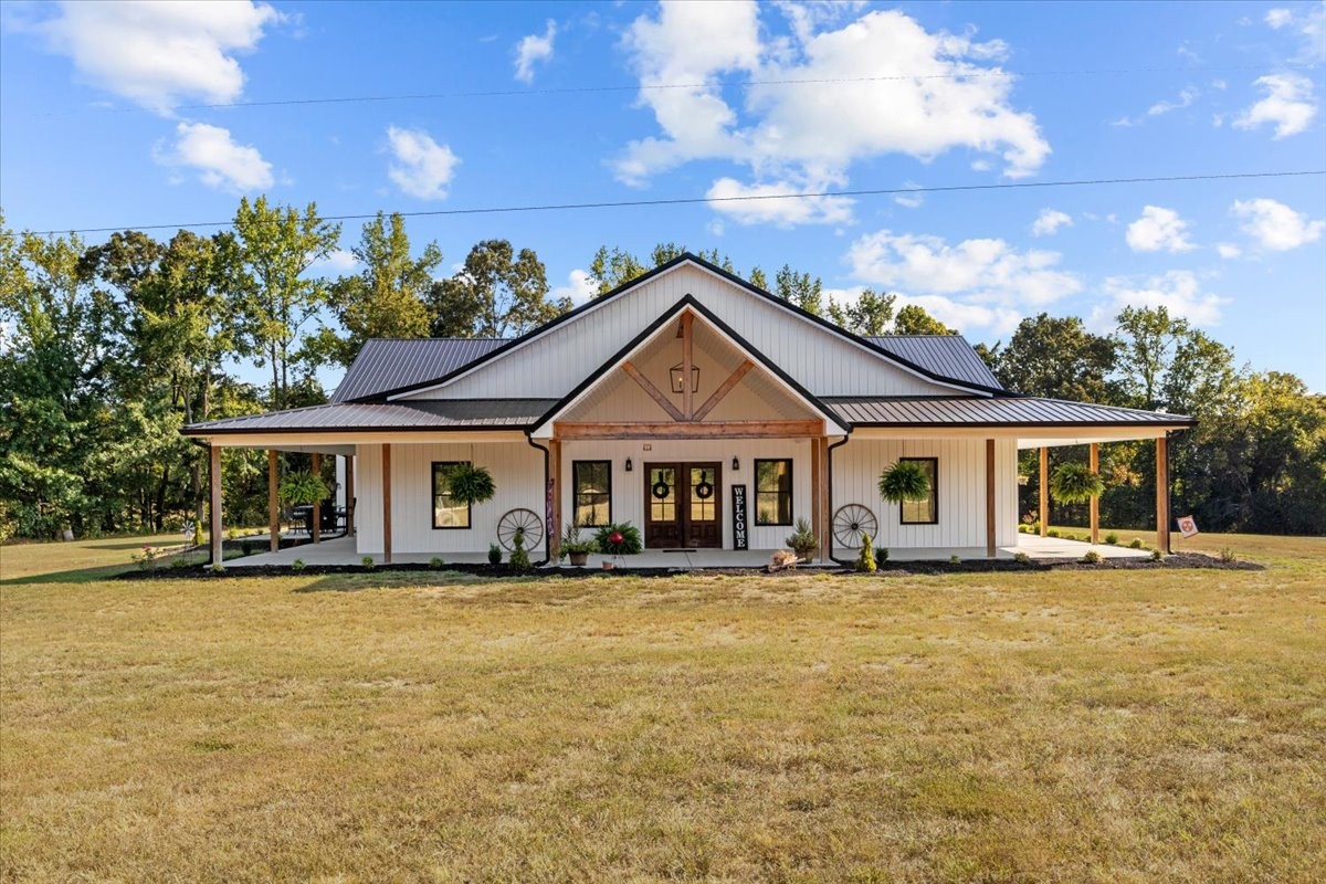 a front view of a house with a yard