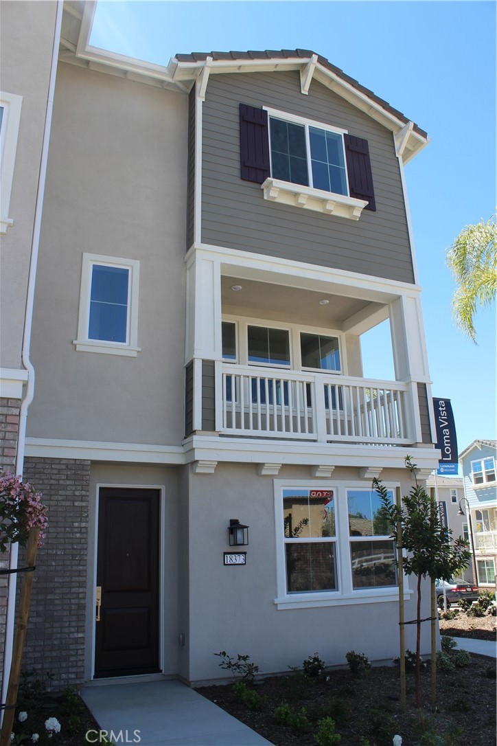 a front view of a house with balcony