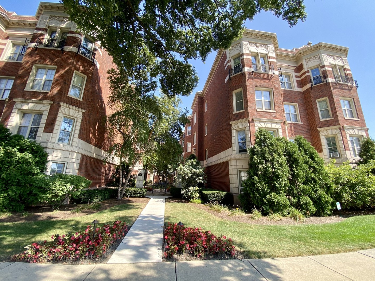 a front view of a multi story residential apartment buildings