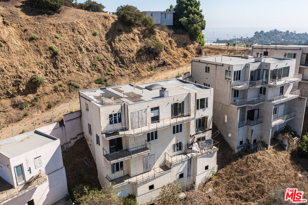 an aerial view of a house with a yard