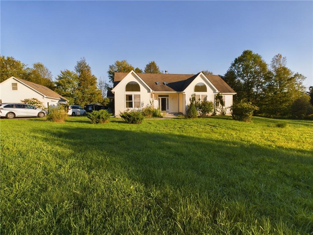 View of front of home featuring a front lawn