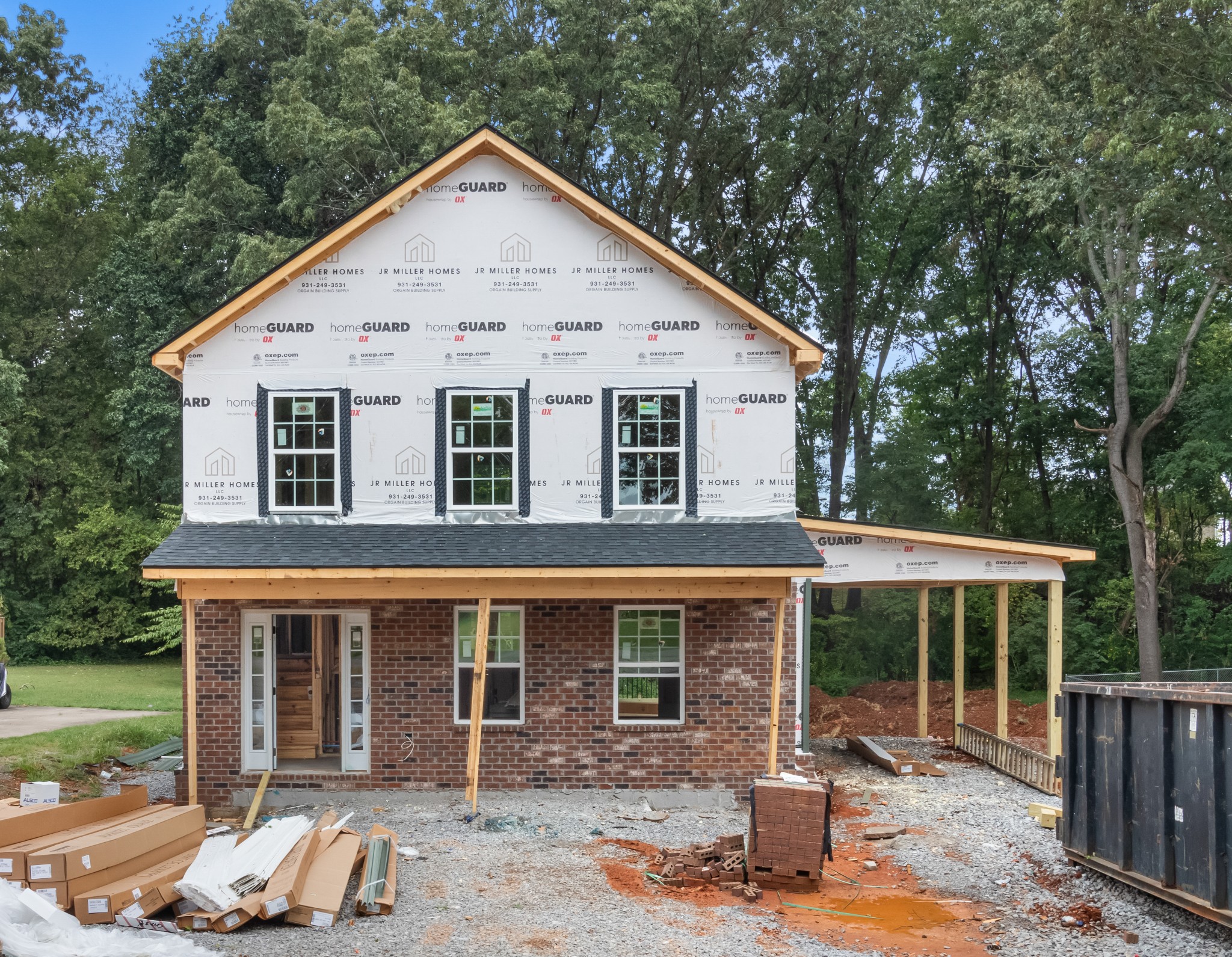 a view of a house with a yard and seating space