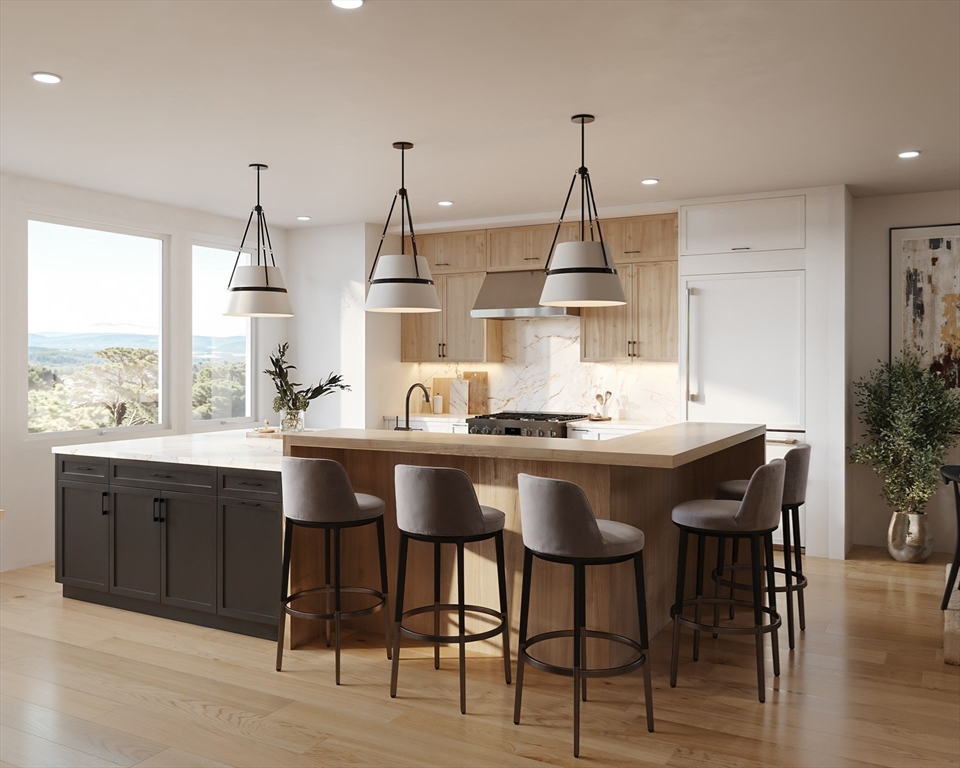 a kitchen with granite countertop a sink cabinets and wooden floor