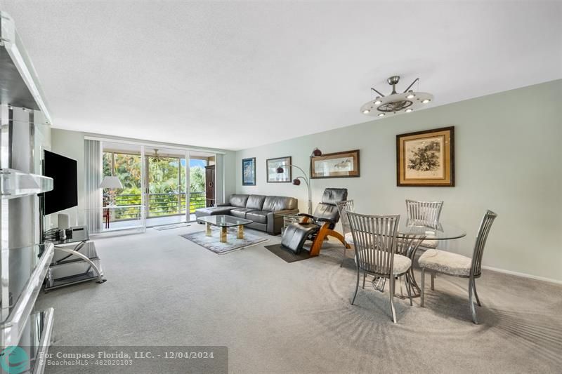 a view of a livingroom with furniture and a window