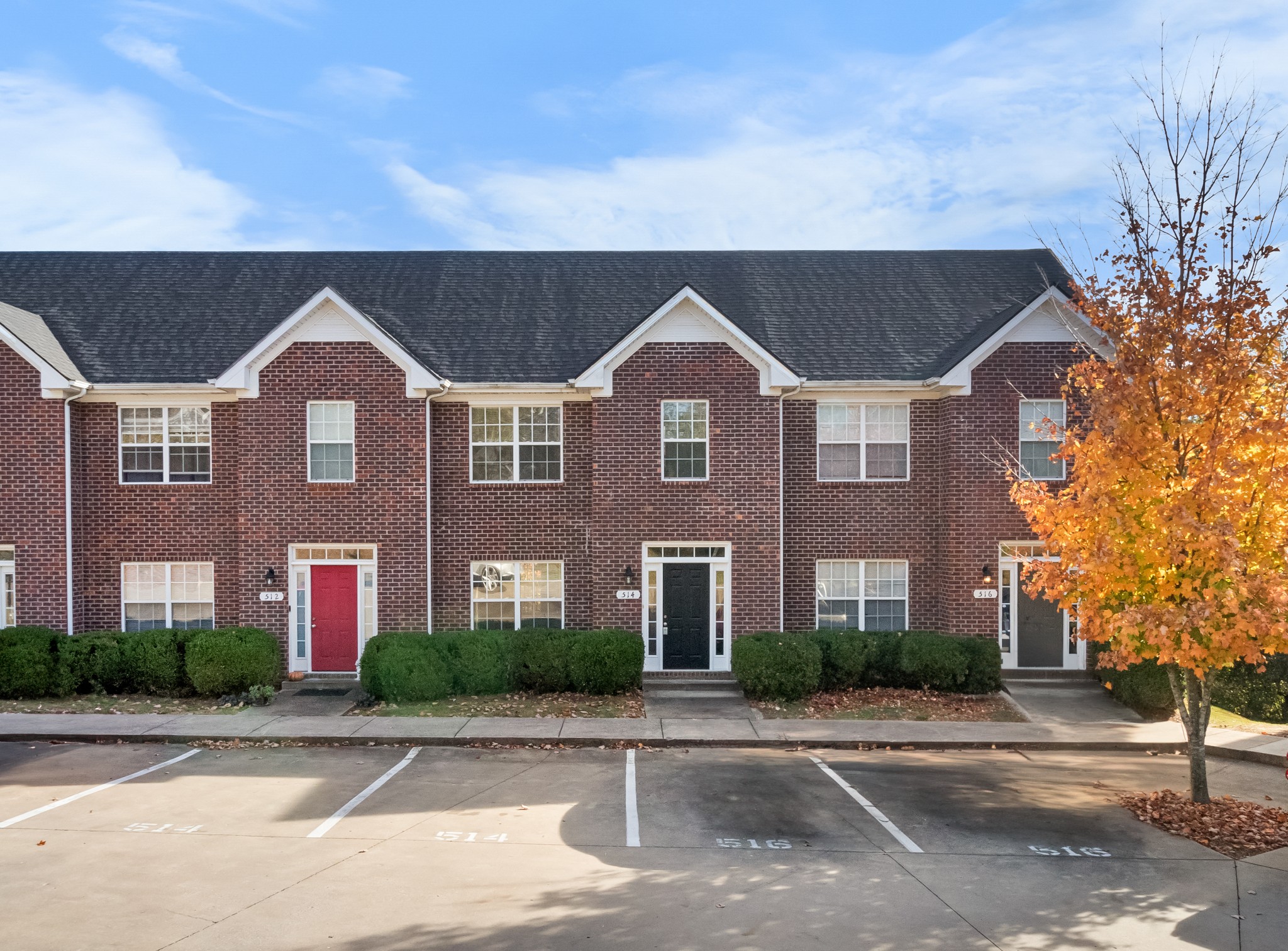 front view of brick house with a yard