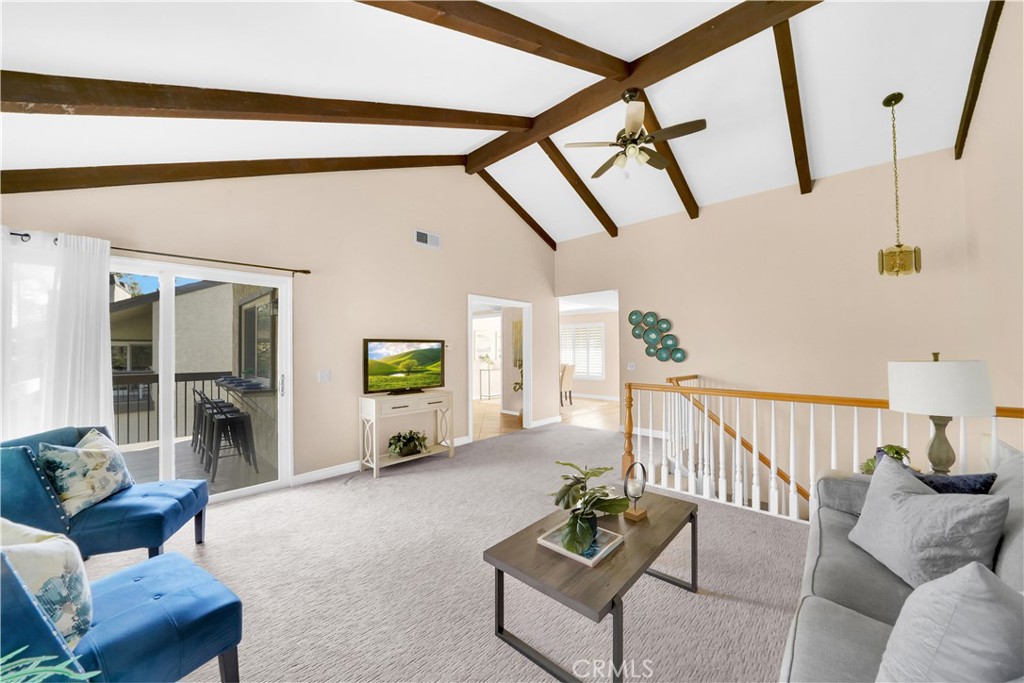 a living room with furniture and a rug