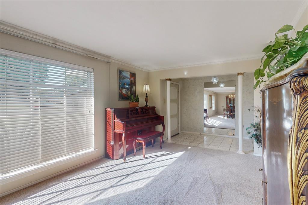 a living room with furniture a fireplace and a window