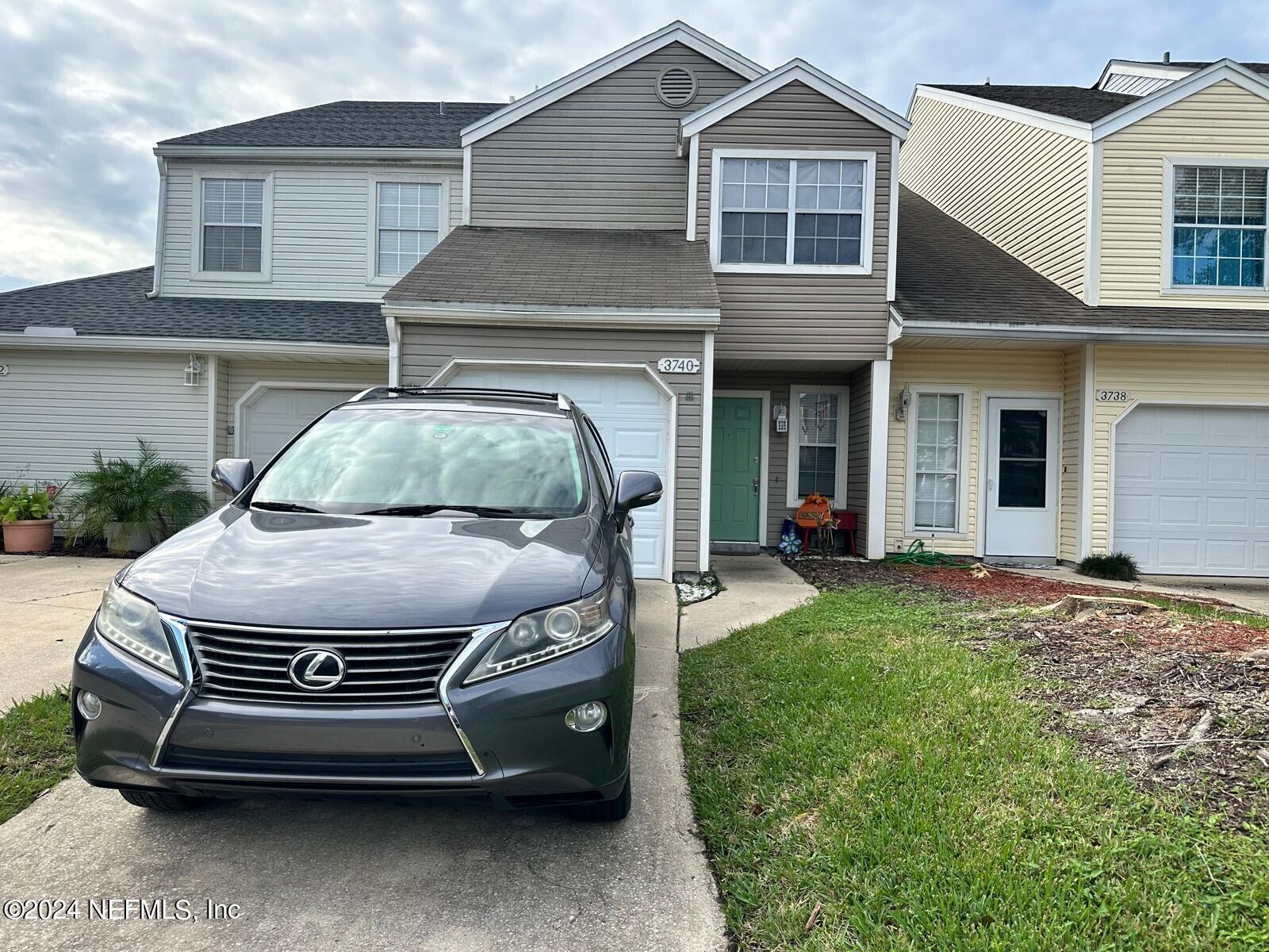 a view of a car in front of house