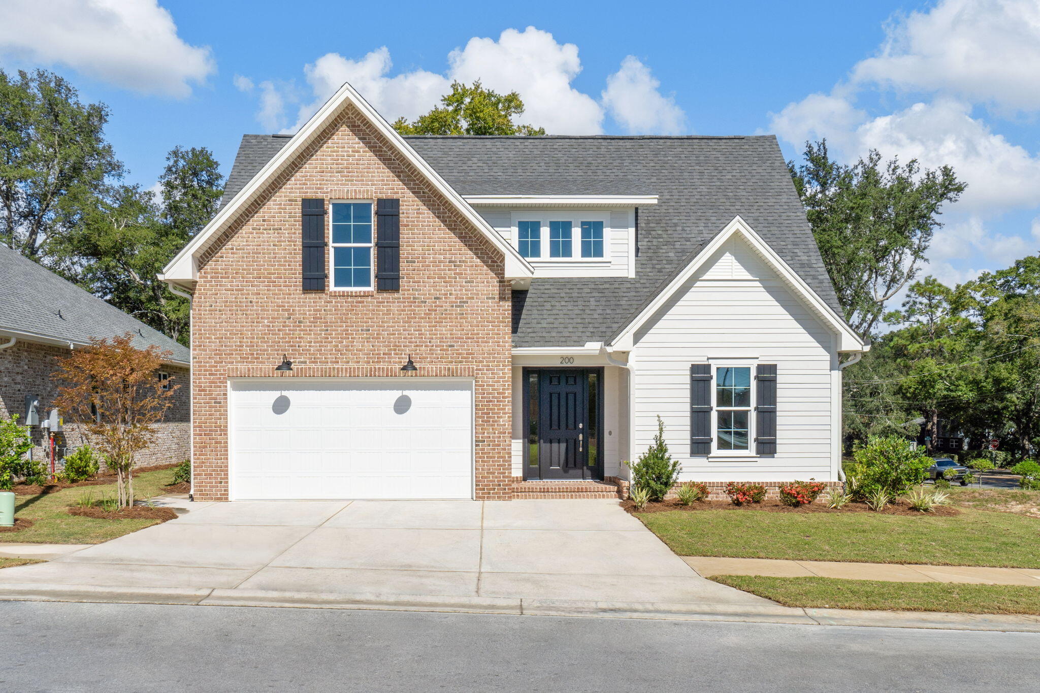 a view of a house with a yard and garage