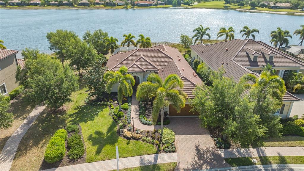 an aerial view of a house with a lake view