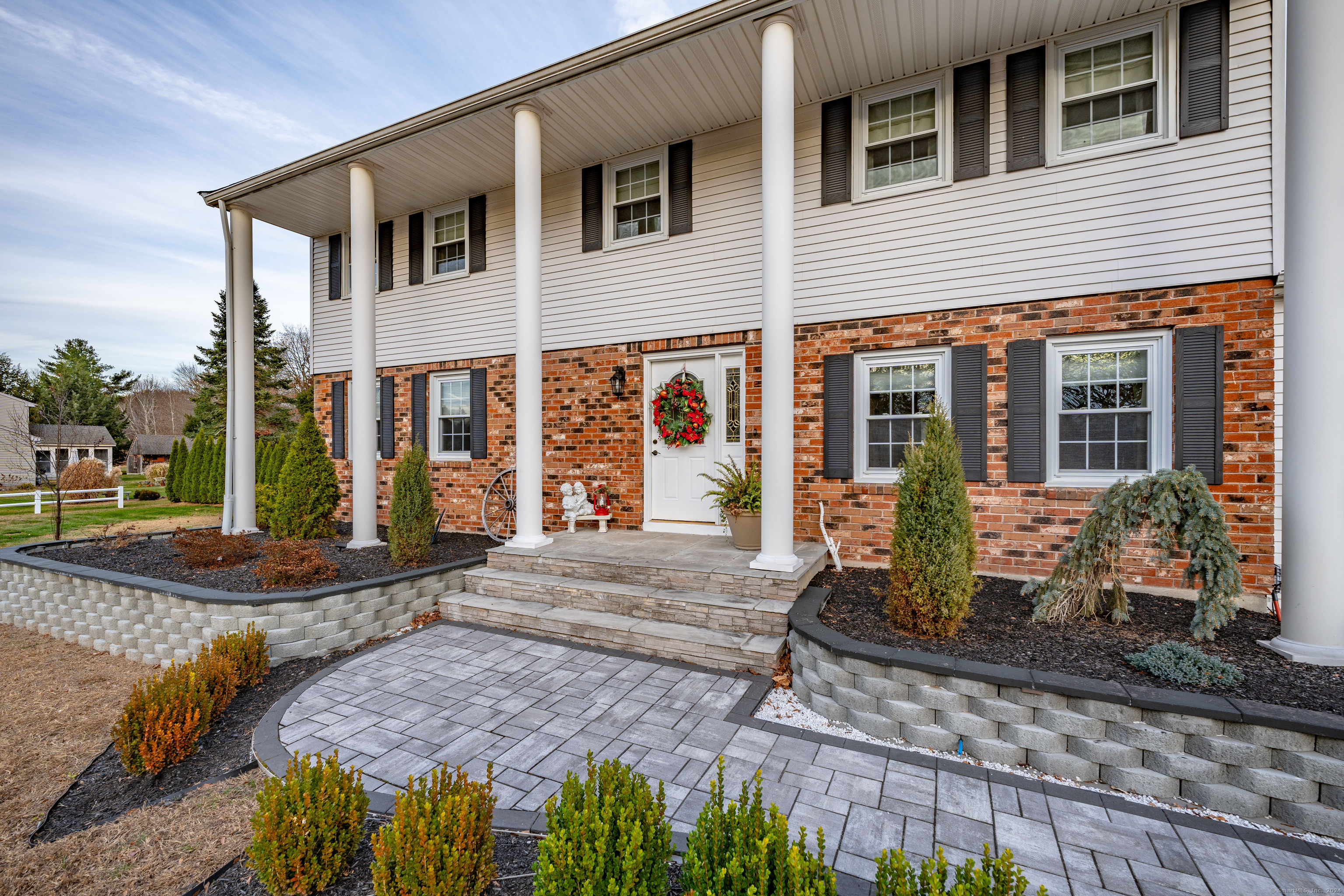 a front view of a house with garden