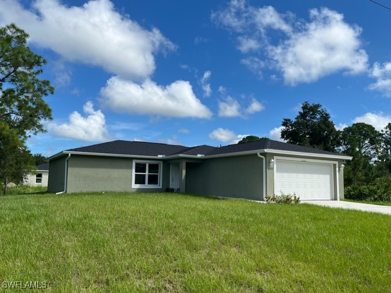 a view of a house with a backyard