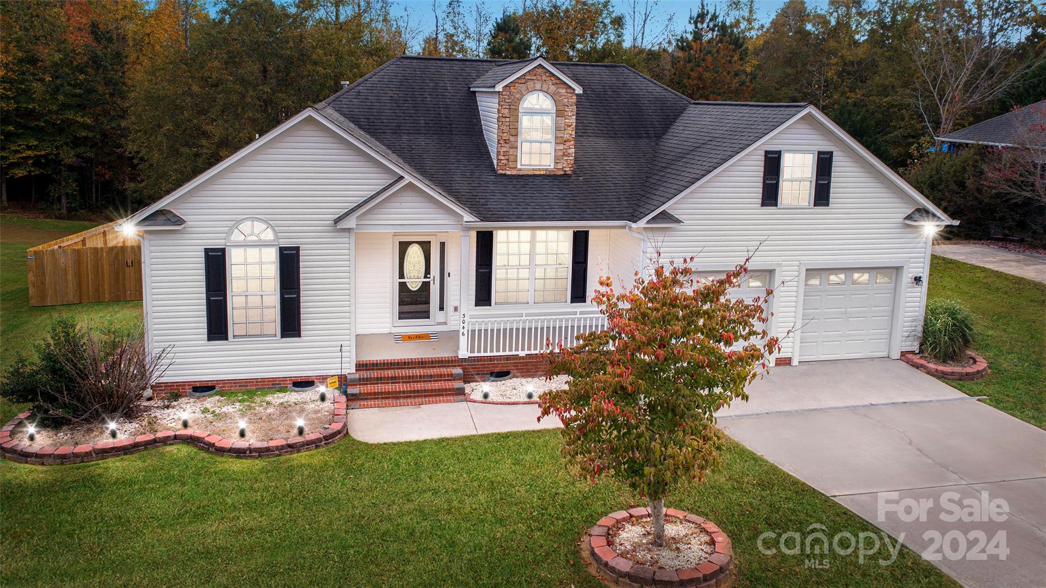 a front view of a house with garden