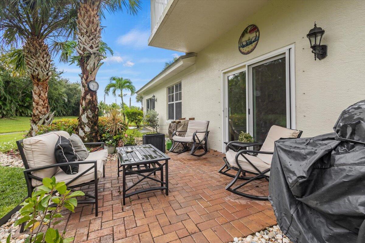 a view of a patio with chairs and table in a patio