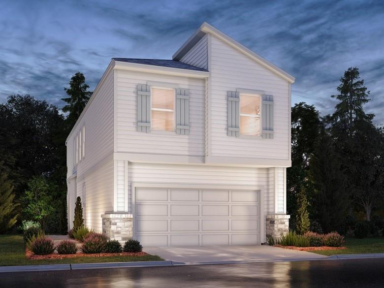 a front view of a house with garage